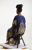  Dina Moses  1 dressed sitting traditional decora long african dress whole body 0002.jpg